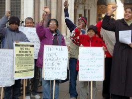 Chagossians in defiant mood outside the Royal Courts of Justice in the Strand on Monday, including Hengride Permal (right)