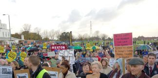 Rally to defend St Helier and Epsom hospitals last November when there were protests about patients being served cold meals  – now St Helier Trust  is removing light bulbs to cut bills