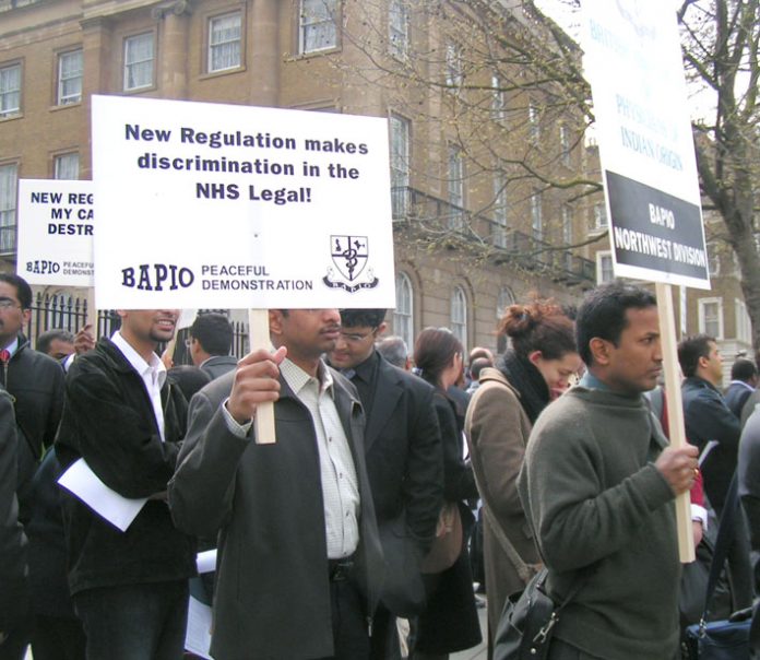 Overseas doctors picket Downing Street after the government changed the rules of their employment last April