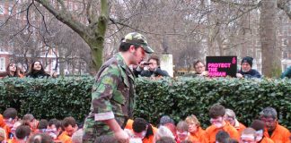 Guantanamo ‘guard’ menacing Amnesty ‘Guantanamo prisoners’ in a demonstration outside the US embassy in London to mark the fifth anniversary  of the first prisoners to be detained there