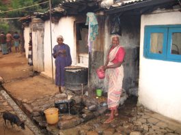 Tea workers are still living in the shacks that were provided by British imperialism in the 19th century. Note the open sewer (bottom left)