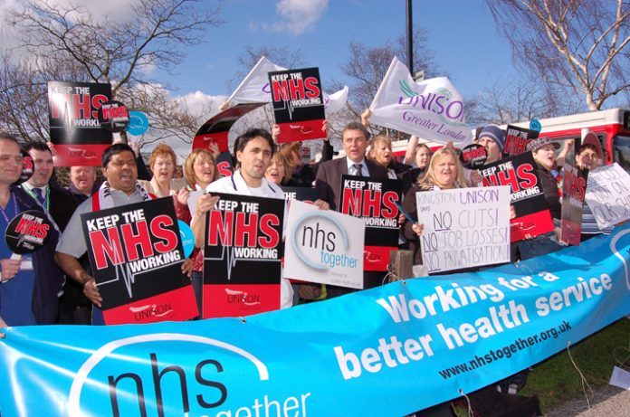 UNISON General Secretary Dave Prentis (centre) protesting with hospital workers outside Kingston Hospital in Surrey yesterday