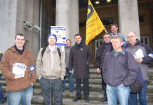 Mark Serwotka, PCS leader (centre), with a group outside the Ministry of Defence yesterday morning