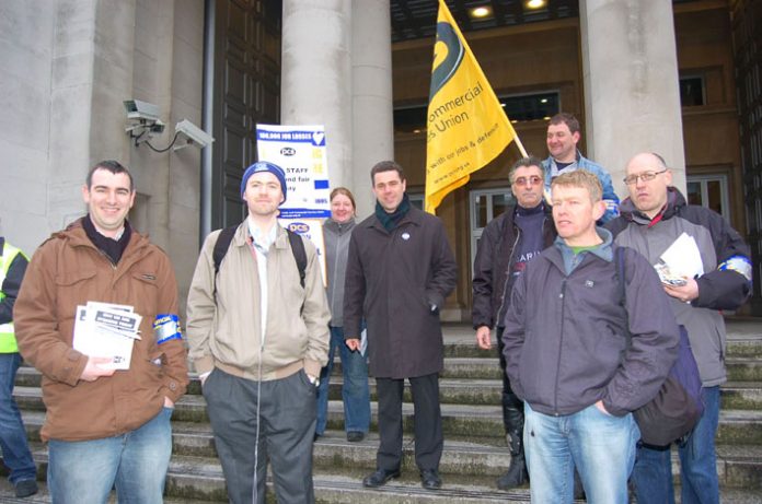 Mark Serwotka, PCS leader (centre), with a group outside the Ministry of Defence yesterday morning