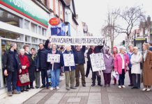 Postal workers and local residents protest against the closure of Mill Hill Post Office in north London