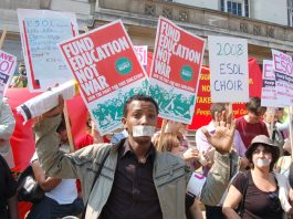 ESOL students taped up their mouths to show their anger at being denied free access to English language classes