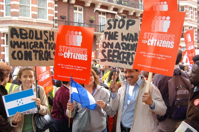 Demonstrators  in central London yesterday showed their support for the Strangers into Citizens campaign and condemned the government’s draconian anti-immigration and asylum laws
