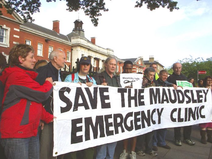 The ‘Save The Maudsley Emergency Clinic’ banner is unfurled at Saturday evening’s demonstration outside the hospital