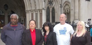 Parkside estate tenant CAROL SWORDS (second from left) with supporters outside the High Court yesterday morning