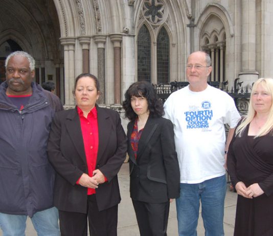 Parkside estate tenant CAROL SWORDS (second from left) with supporters outside the High Court yesterday morning