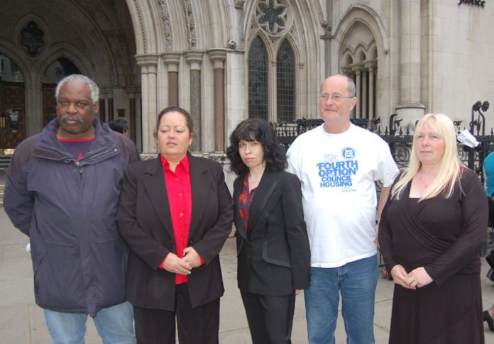 Parkside estate tenant CAROL SWORDS (second from left) with supporters outside the High Court yesterday morning