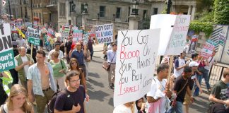 Marchers in London on August 5th last year against Israel’s bombing of Lebanon demand a boycott of Israeli goods