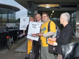 RMT leader BOB CROW (centre holding placard) campaigning against the privatisation of the East London tube Line