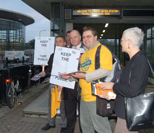 RMT leader BOB CROW (centre holding placard) campaigning against the privatisation of the East London tube Line