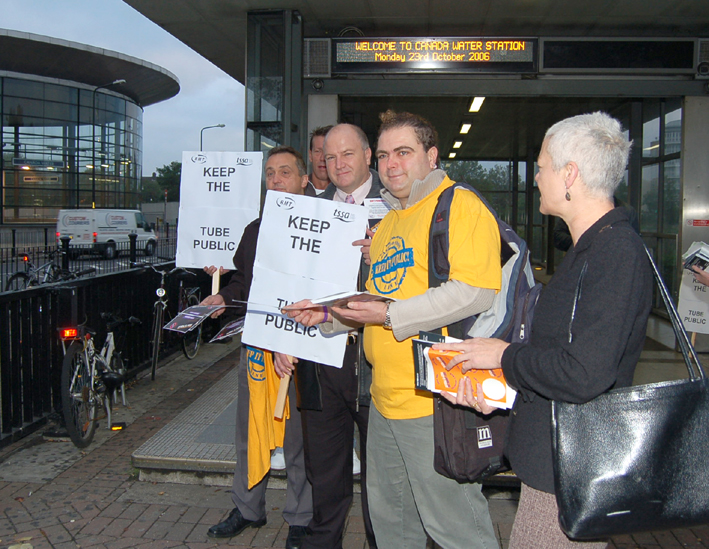 RMT leader BOB CROW (centre holding placard) campaigning against the privatisation of the East London tube Line