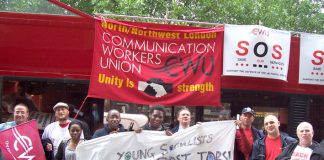 Postal workers supported by Young Socialists demonstrate outside the Royal Mail headquarters in Old Street yesterday at midday