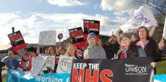 Health workers demonstrating against cuts outside Kingston Hospital in March this year