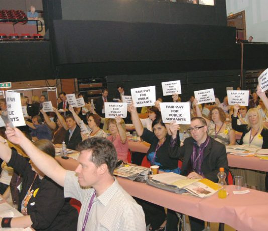 A section of delegates at the TUC Congress greet Brown with their placards