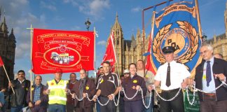 Trade unionists in chains outside the House of Commons yesterday afternoon demanding support for the Trade Union Freedom Bill