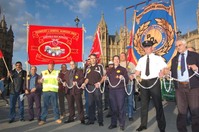 Trade unionists in chains outside the House of Commons yesterday afternoon demanding support for the Trade Union Freedom Bill