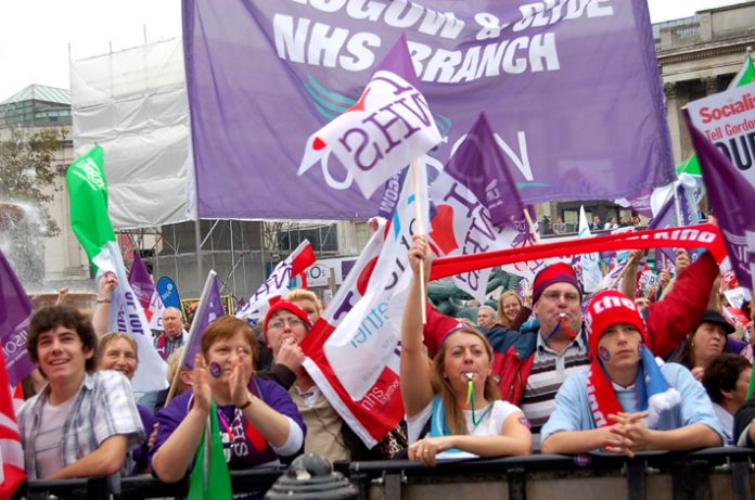 Young workers at the front of last Saturday’s NHSTogether march in Trafalgar Square. Youth will not submit to forced labour