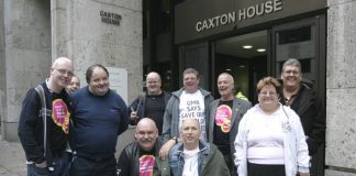 Remploy workers occupying the Department of Work and Pensions head office yesterday, surrounded by police. The protesters demanded that the 28 Remploy factories be kept open
