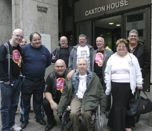 Remploy workers occupying the Department of Work and Pensions head office yesterday, surrounded by police. The protesters demanded that the 28 Remploy factories be kept open