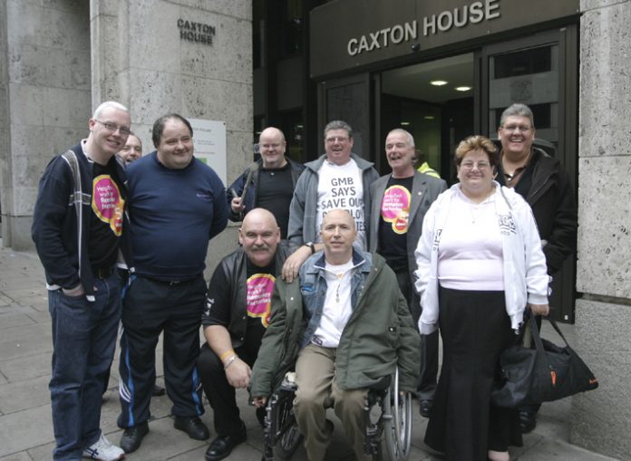 Remploy workers occupying the Department of Work and Pensions head office yesterday, surrounded by police. The protesters demanded that the 28 Remploy factories be kept open