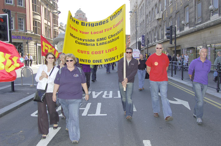 FBU members marching in Liverpool in September last year against the closure of five local fire control centres in the north west of England to be replaced by one regional control