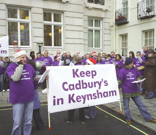 Cadbury’s workers singing Christmas carols outside the Cadbury Schweppes headquarters in Berkeley Square yesterday. The company wants to export their jobs to Poland