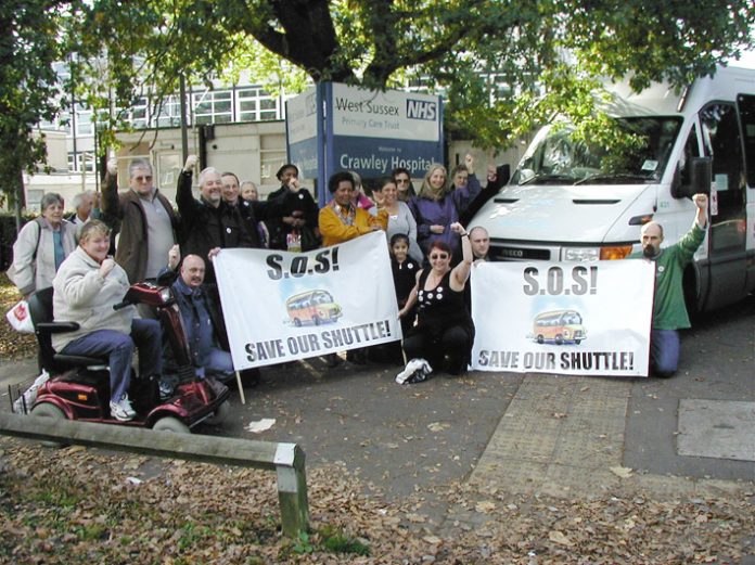 Campaigners outside Crawley Hospital  fighting to defend the shuttle bus service