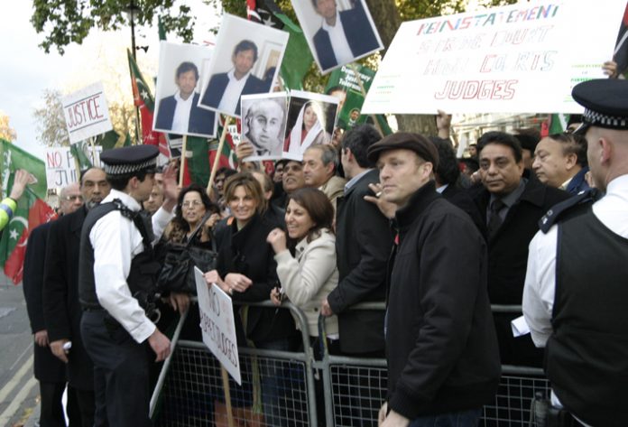 Pakistanis demonstrate against the Musharaff dictatorship outside 10 Downing Street on November 10th