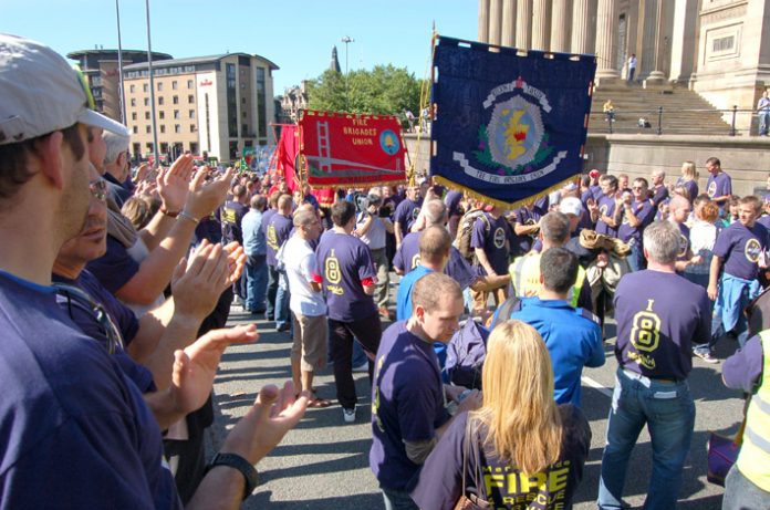 Humberside and Tayside FBU banners on a national FBU demonstration in Liverpool