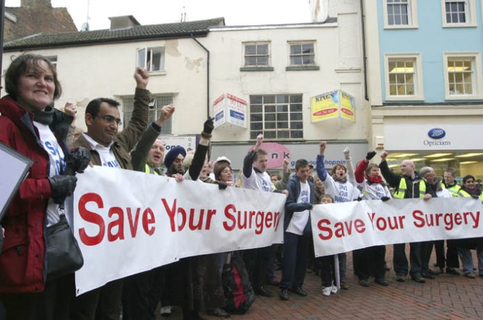 Over fifty GPs, surgery staff and their relatives urged Rugby residents to ‘Save Your Surgery’