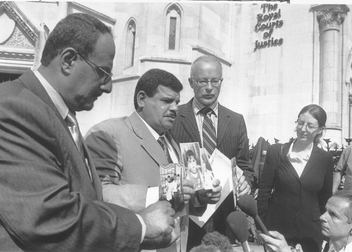 KIFA  MUNTARI (left, now deceased) and Baha Mousa’s father DAOUD MOUSA (second left) with lawyers at the High Court in London in 2004, after his son’s brutal death at the hands of British troops in southern Iraq