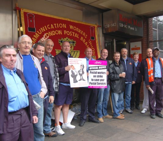 Determined postal workers on the picket line during strike action across Royal Mail last year against pay cuts and attacks on their conditions of service