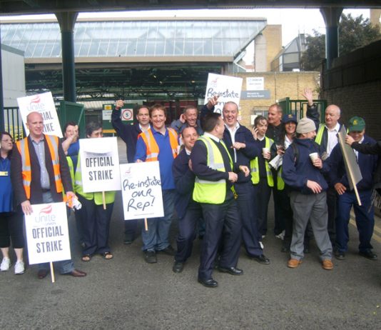 Striking bus workers outside the Ash Grove depot in Hackney yesterday demanding the reinstatement of their steward