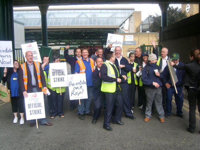 Striking bus workers outside the Ash Grove depot in Hackney yesterday demanding the reinstatement of their steward