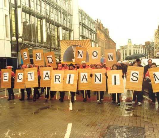 Communication Workers Union banner at the front of a demonstration during the general strike in Belfast in January 2002 following the sectarian killing of a young postal worker