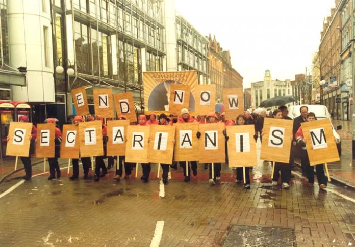 Communication Workers Union banner at the front of a demonstration during the general strike in Belfast in January 2002 following the sectarian killing of a young postal worker