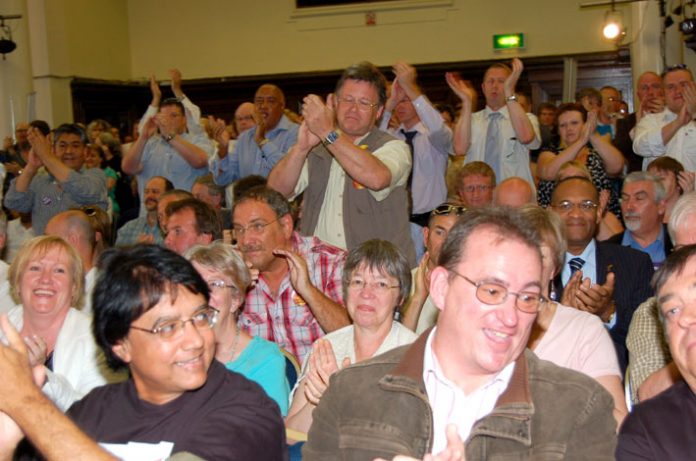 Many trade unionists stood to applaud when Brian Caton said the POA would defy a government strike ban against prison officers and called on all the public sector unions to join them in a one-day strike