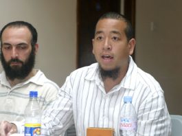 Investigate Crimes Committed Against Binyam Mohamed ‘Reprieve’ investigator CHRIS CHANG (speaking) with ex-Guantánamo prisoner BISHER EL-RAWI