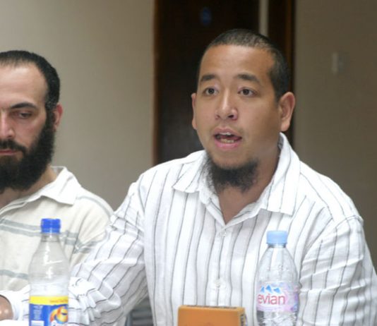 ‘Reprieve’ investigator CHRIS CHANG (speaking) with ex-Guantánamo prisoner BISHER EL-RAWI