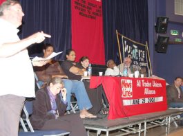 Secretary of the North East London Council of Action Bill Rogers with (from the left) ANNA ATHOW, HENGRIDE PERMAL, LAKHINDER SARAN, SHEILA TORRANCE, DR RAJ and DAVE WILTSHIRE on the platform at the News Line-ATUA Conference on Sunday