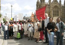 A group of Chagos Islanders outside the Houses of Parliament with GMB official PAUL MALONEY
