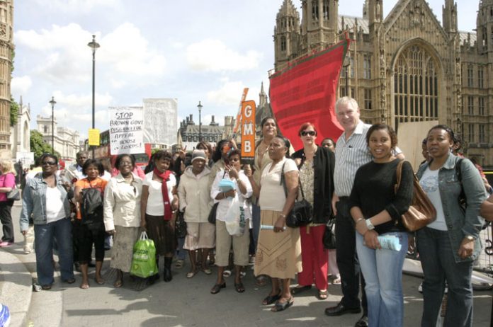 A group of Chagos Islanders outside the Houses of Parliament with GMB official PAUL MALONEY