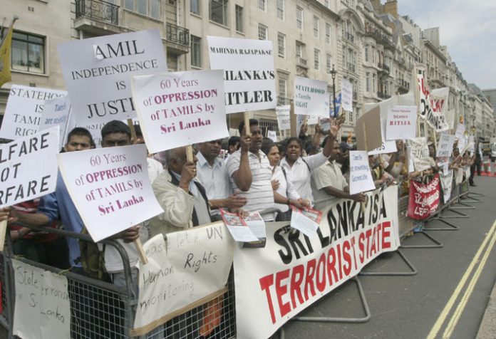 Demonstrators in London opposing the visit of Sri Lankan Premier Rajapakse