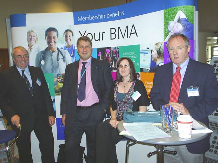 A group of BMA representatives happy at the stand their conference is taking in defence of the NHS