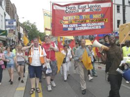 North East London Council of Action banner leads the 1,000-strong march through Enfield Town