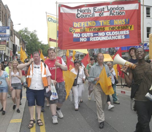 North East London Council of Action banner leads the 1,000-strong march through Enfield Town